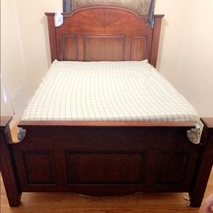 Queen sized wooden bed frame with mattress